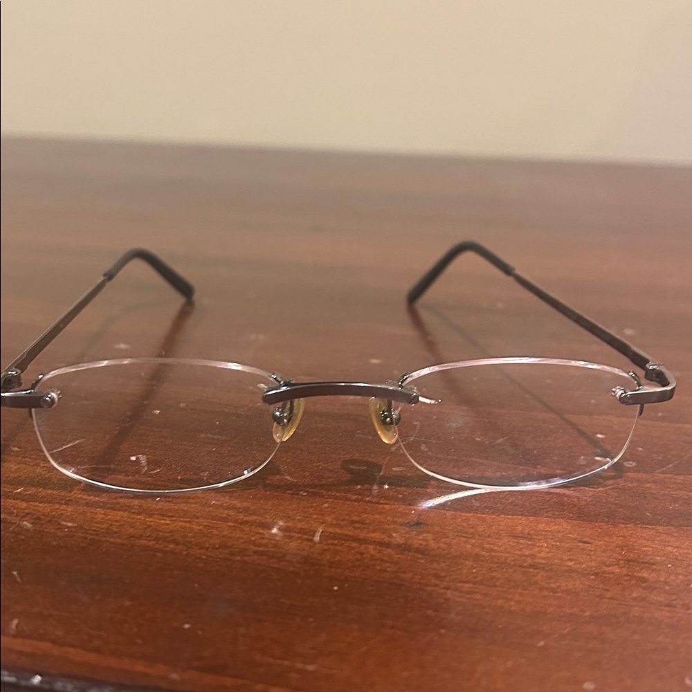 Cartier Women's Glasses in Black and titanium.